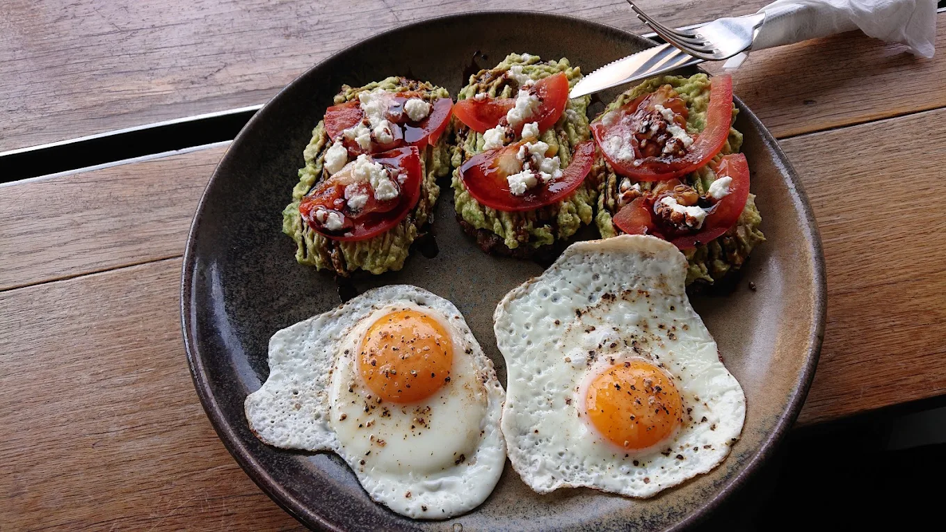 The Super Dave — paleo toast with avocado, tomato, goat cheese and fried eggs